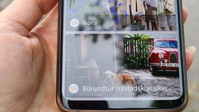 Hand som håller mobiltelefon