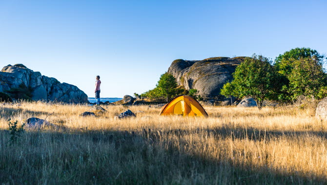 Woman beside a tent in Bohuslän
