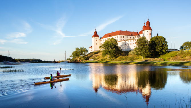 Couple kayaking outside a white castle